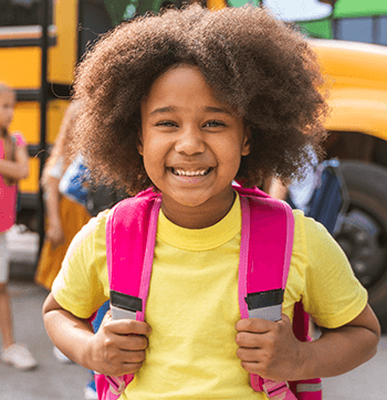 Smiling kid with backpack